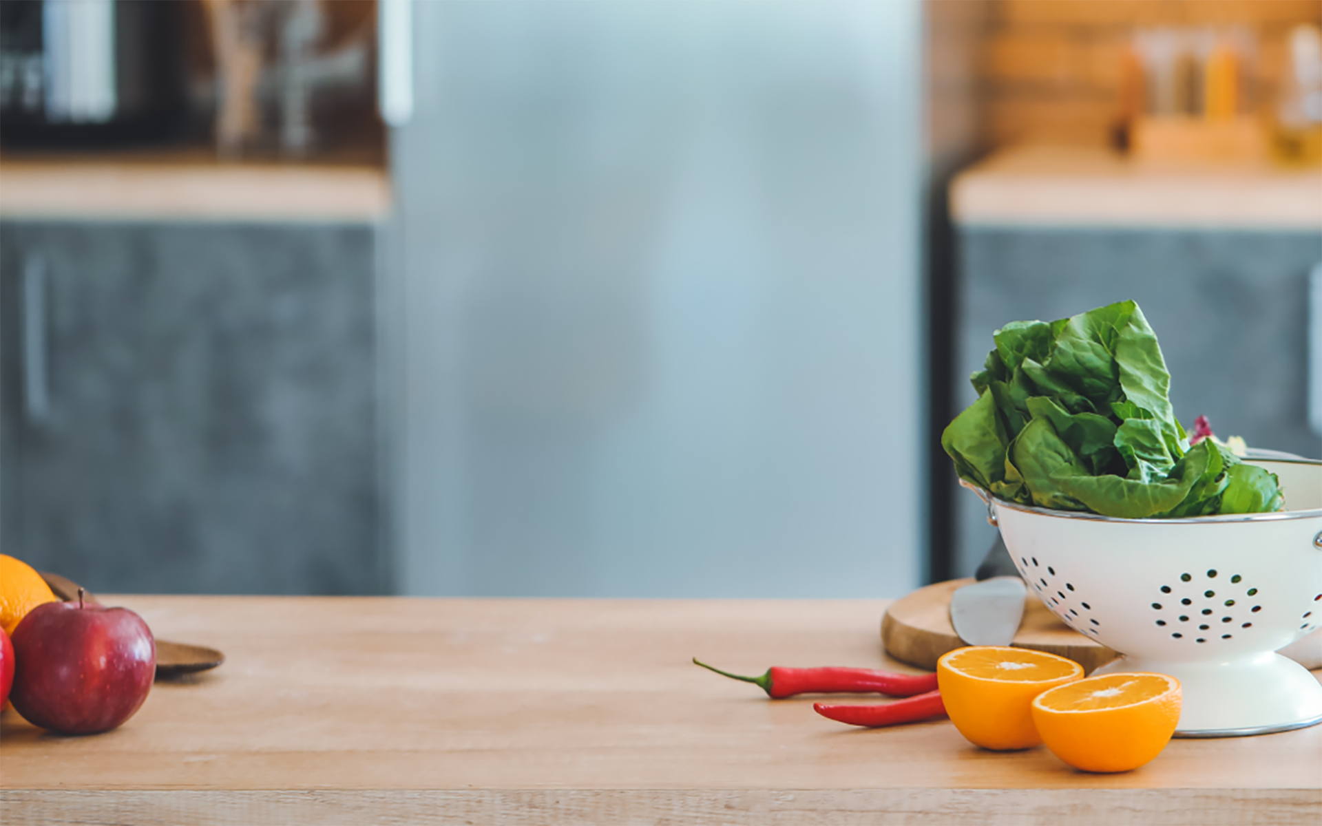Fresh fruit and veg on a wooden kitchen bench
