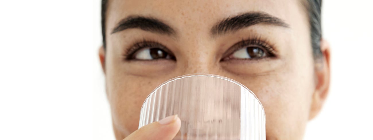 Francesca Hung drinking a glass of water